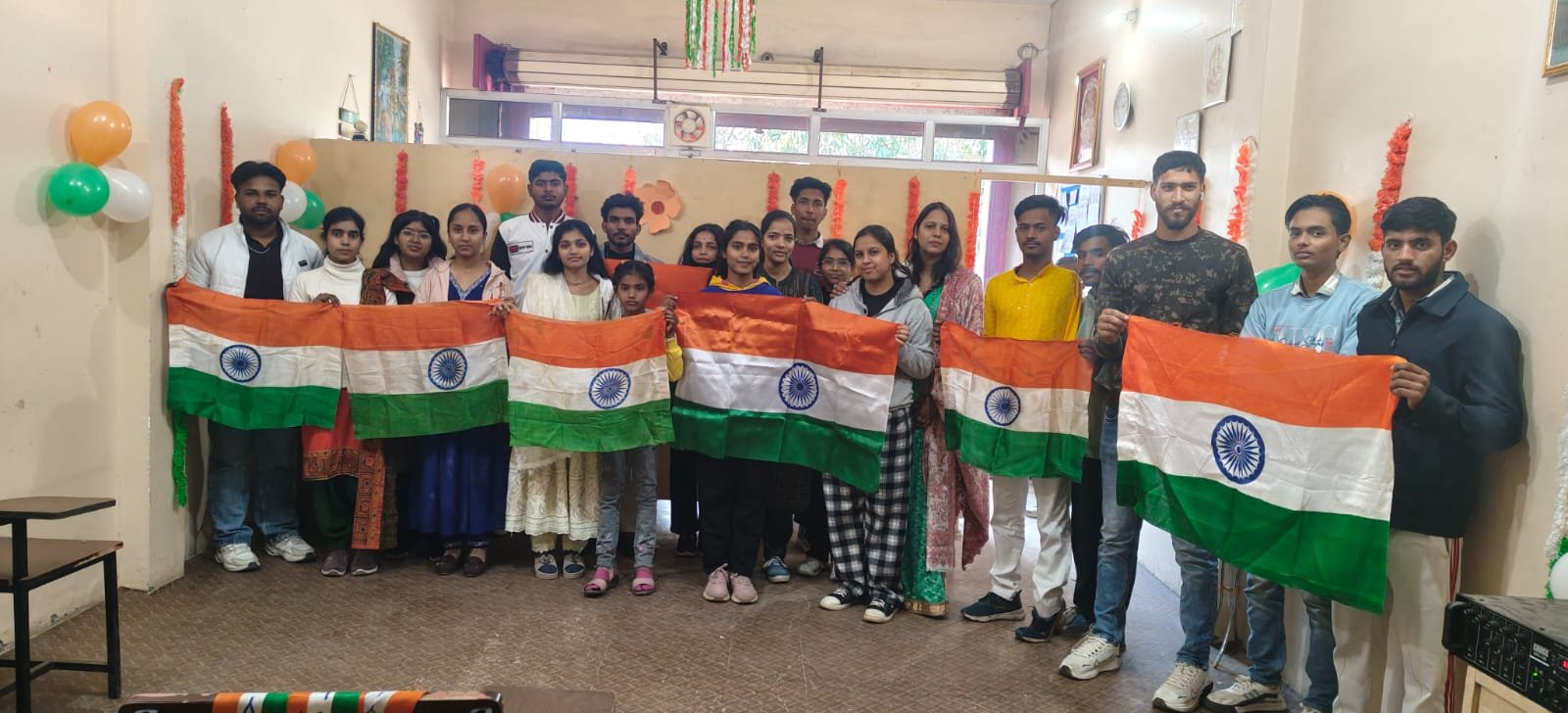Students celebrating Republic Day at BEWS with national flags
