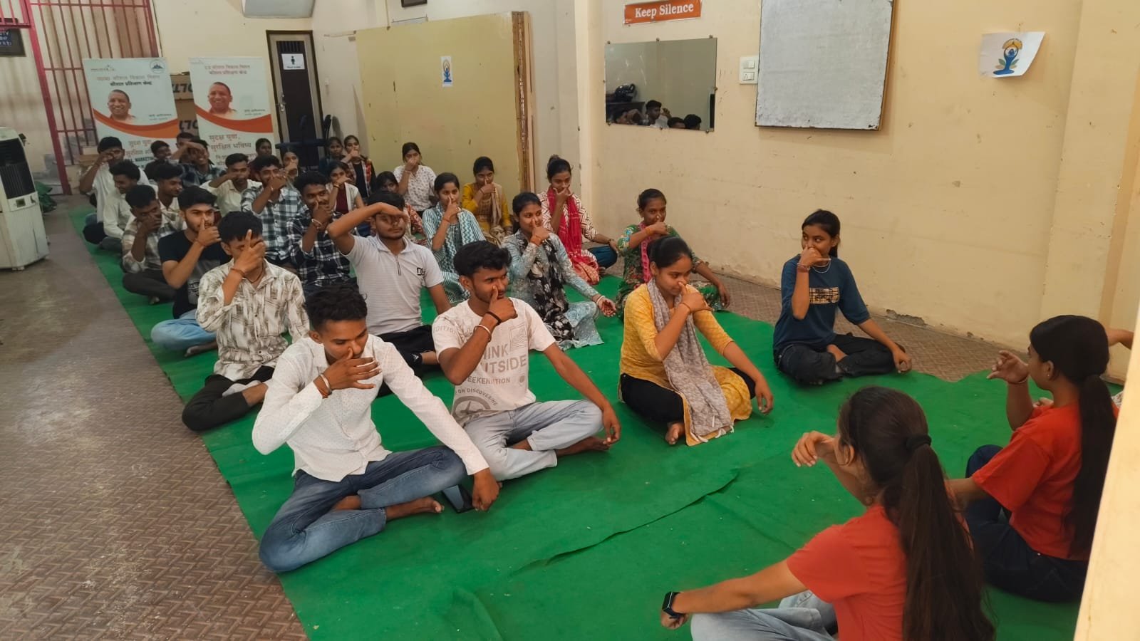 Students learning pranayama breathing exercises